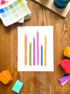 colorful watercolor of pencils archival print, surrounded by geometric toys on a wooden surface.  hand-painted by katie sinclair and perfect for a playroom or kid bedroom.