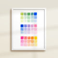 Framed archival watercolor print of color swatches with blue, green, yellow, and pink by Katie Sinclair.