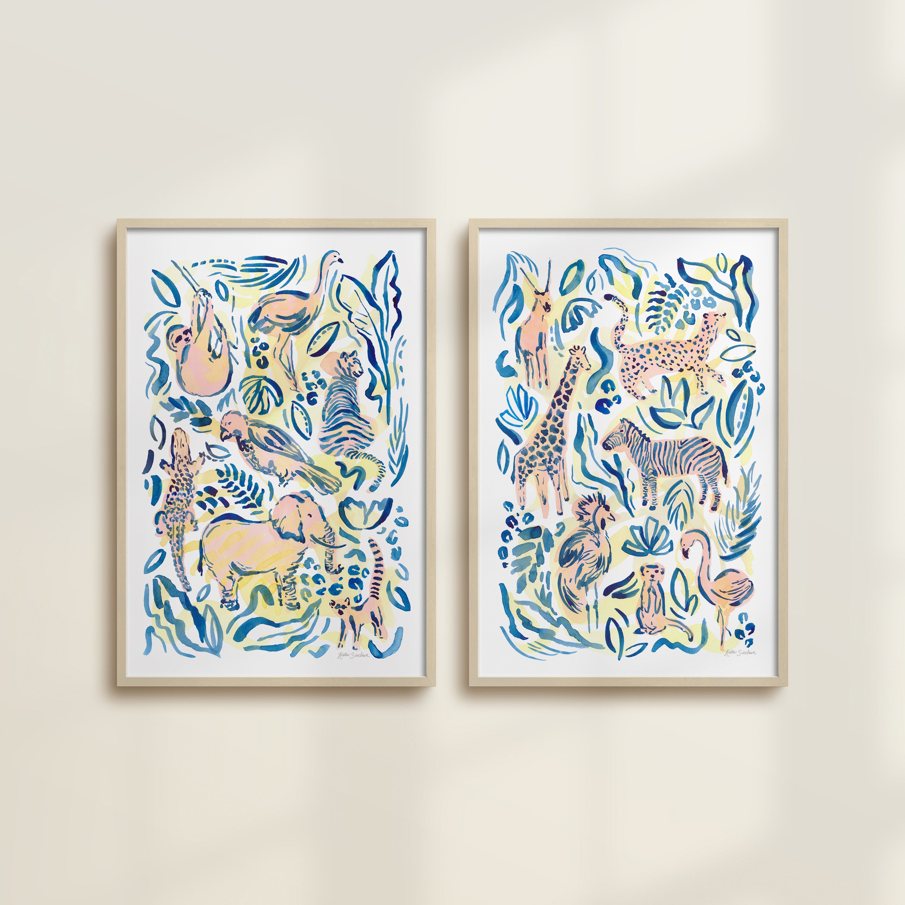 The Safari Jungle watercolor by Katie Sinclair, perfect for nurseries or playrooms.  Featured in the multi pink, blue, and yellow colorway with wooden frames and no mat.