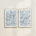 The Safari Jungle watercolor by Katie Sinclair, perfect for nurseries or playrooms.  Featured in the blue colorway with wooden frames and no mat.