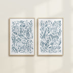 The Safari Jungle watercolor by Katie Sinclair, perfect for nurseries or playrooms.  Featured in the blue colorway with wooden frames and no mat.