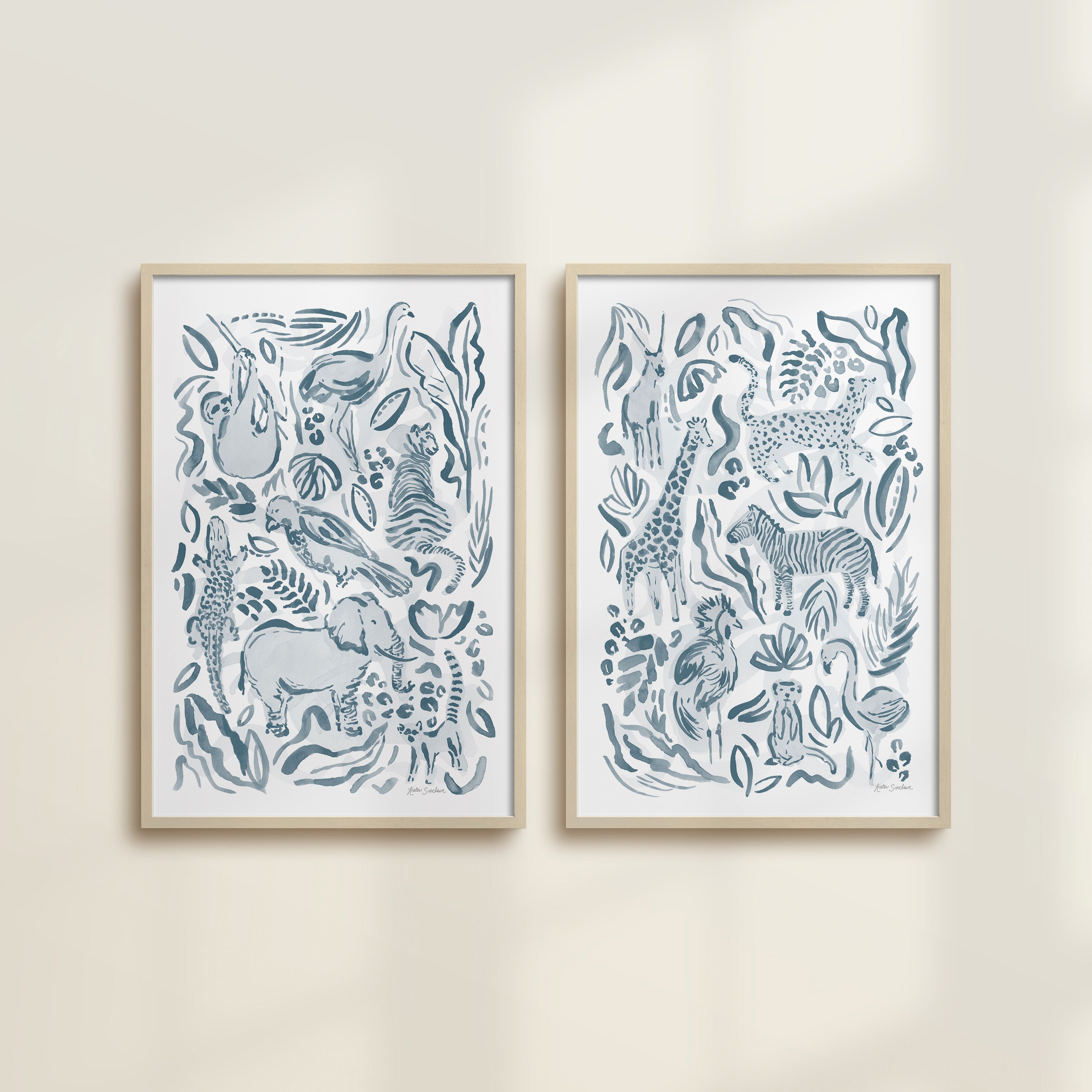 The Safari Jungle watercolor by Katie Sinclair, perfect for nurseries or playrooms.  Featured in the blue colorway with wooden frames and no mat.