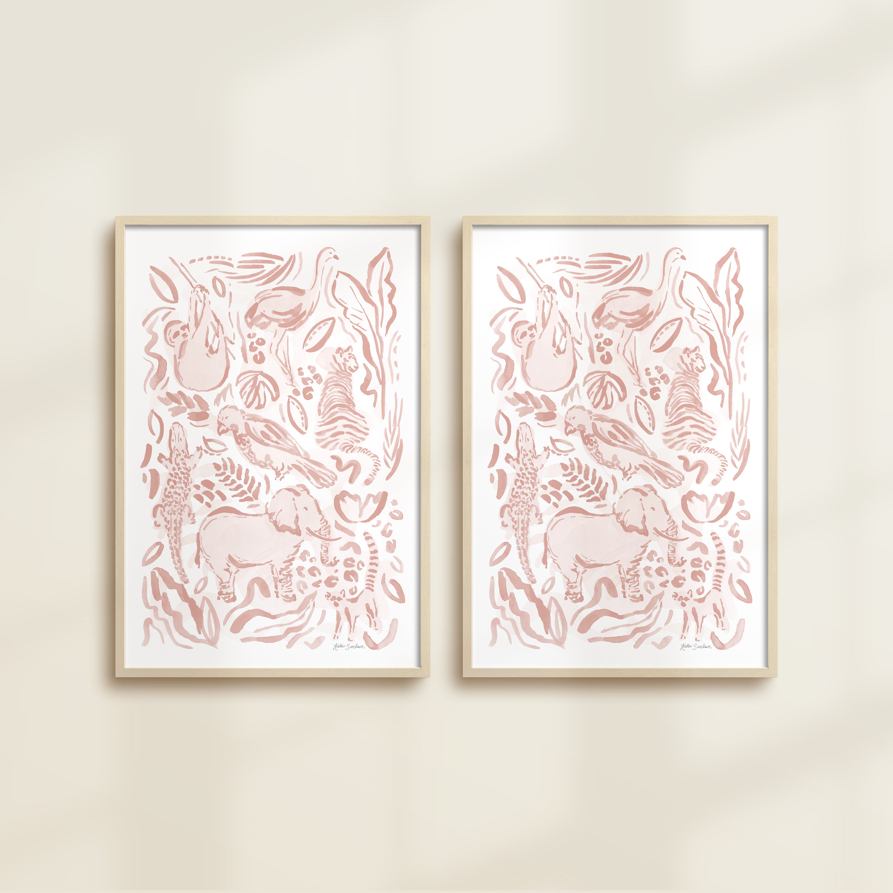 The Safari Jungle watercolor by Katie Sinclair, perfect for nurseries or playrooms.  Featured in the pink blush colorway with wooden frames and no mat.