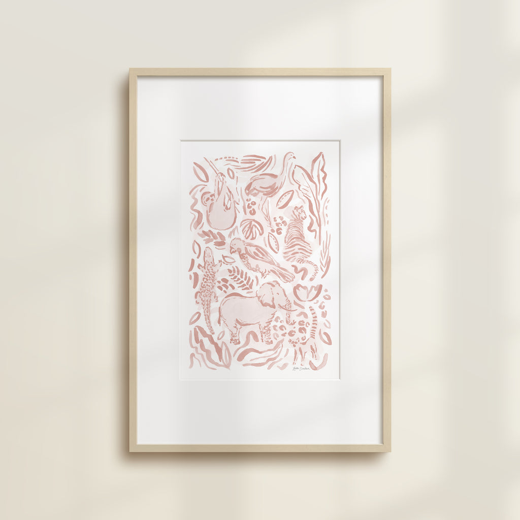 The Safari Jungle Elephant by Katie Sinclair watercolor print in the pink blush colorway, in a wooden frame with a white mat.