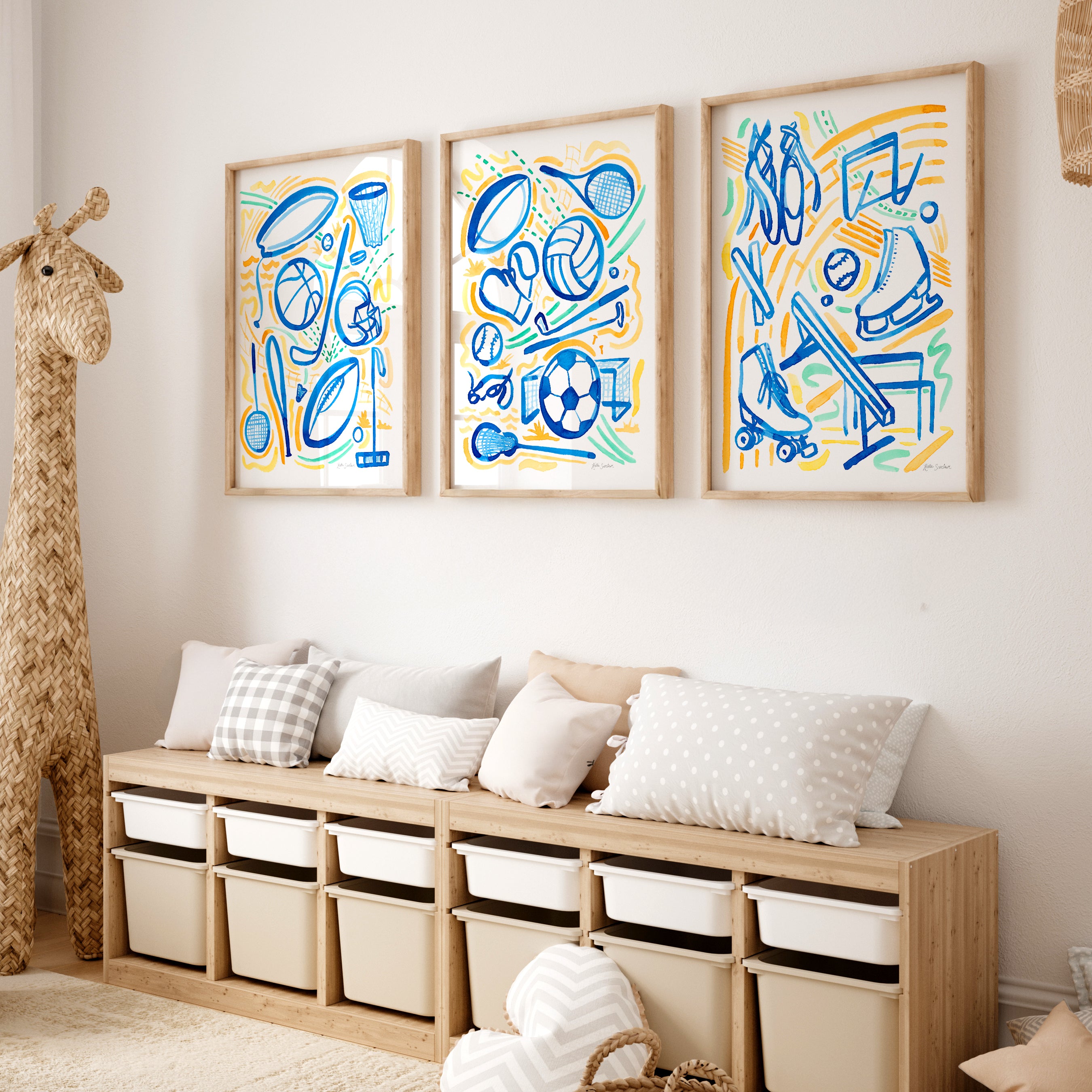 Three colorful abstract art pieces on a wall above a wooden bench with storage bins.