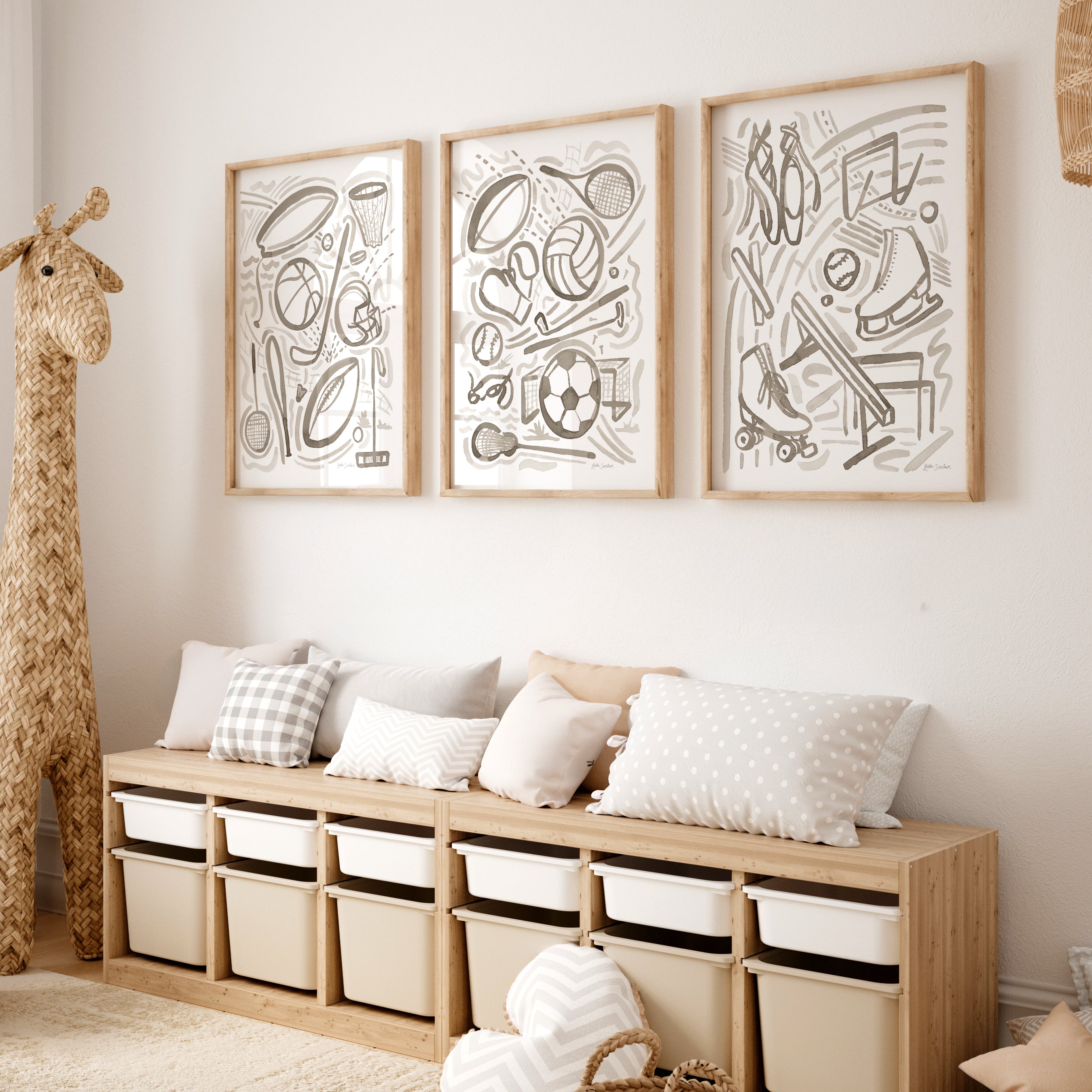 Wooden bench with storage bins against a wall with framed sports gray watercolor abstract art