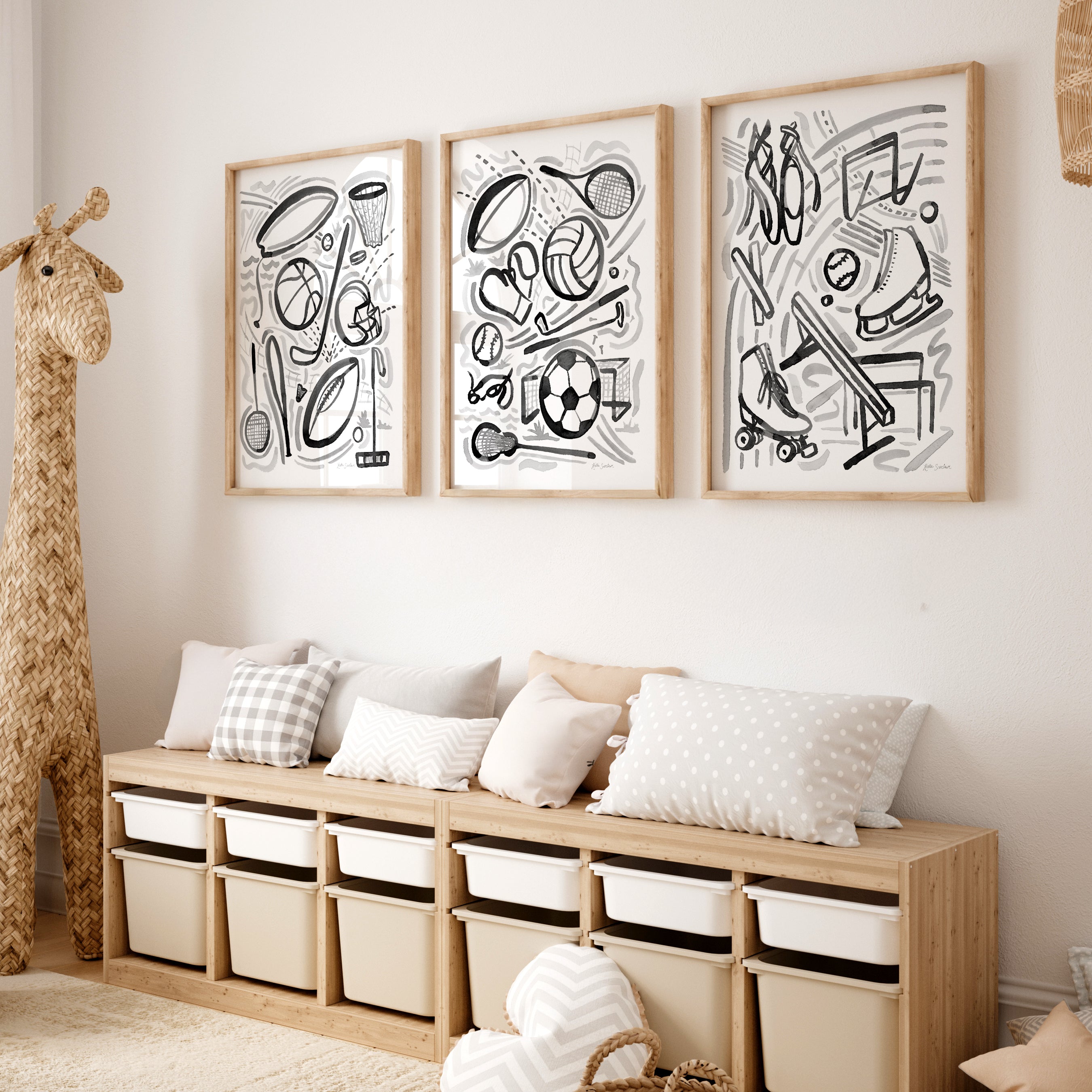 Wooden bench with storage bins against a wall with framed black and white abstract art.