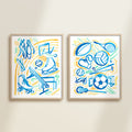 Two framed playful sports watercolor art prints in frames featuring tennis, soccer, ballet and baseball for kids nursery or playroom wall décor.