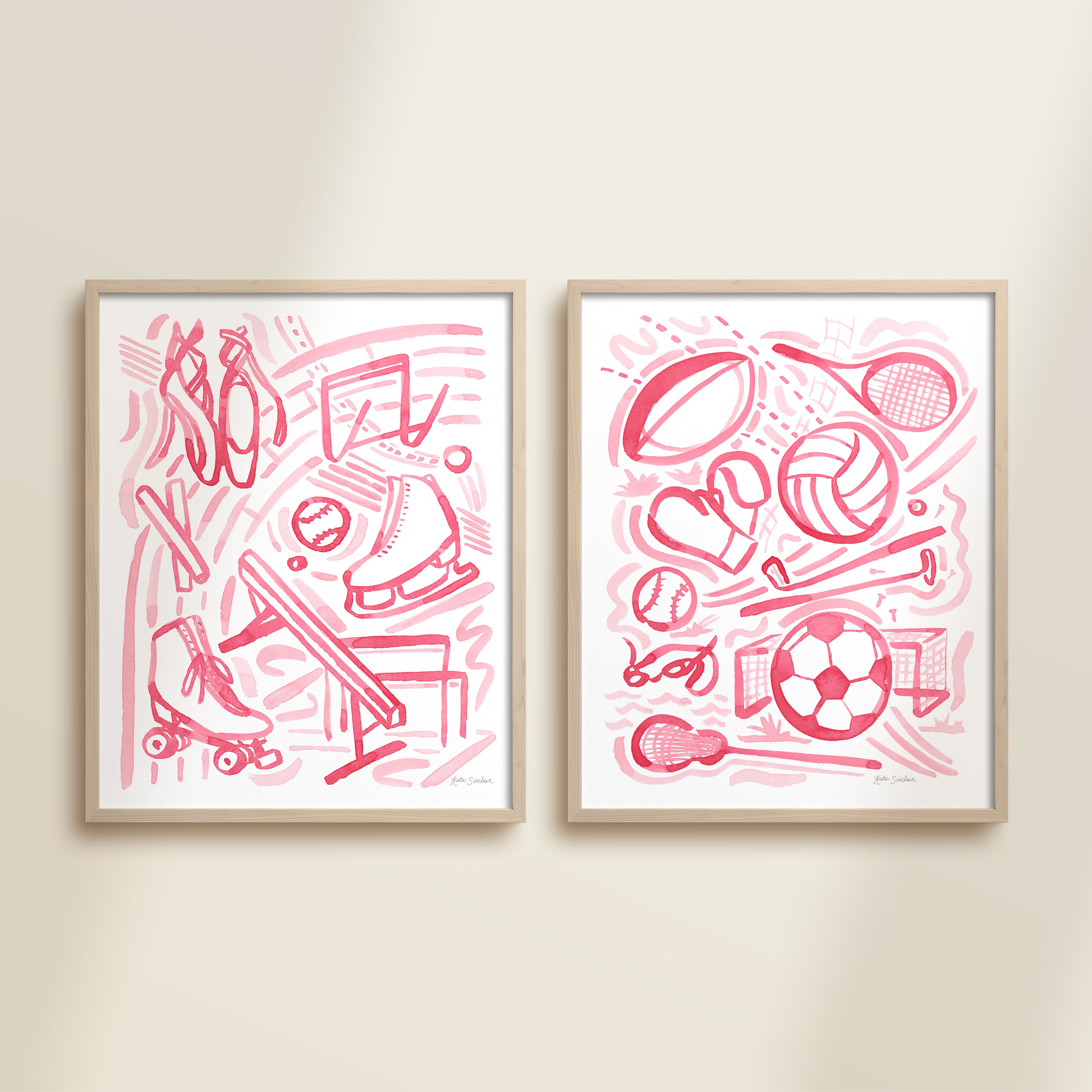 Two framed pink sports-themed artworks on a beige wall.
