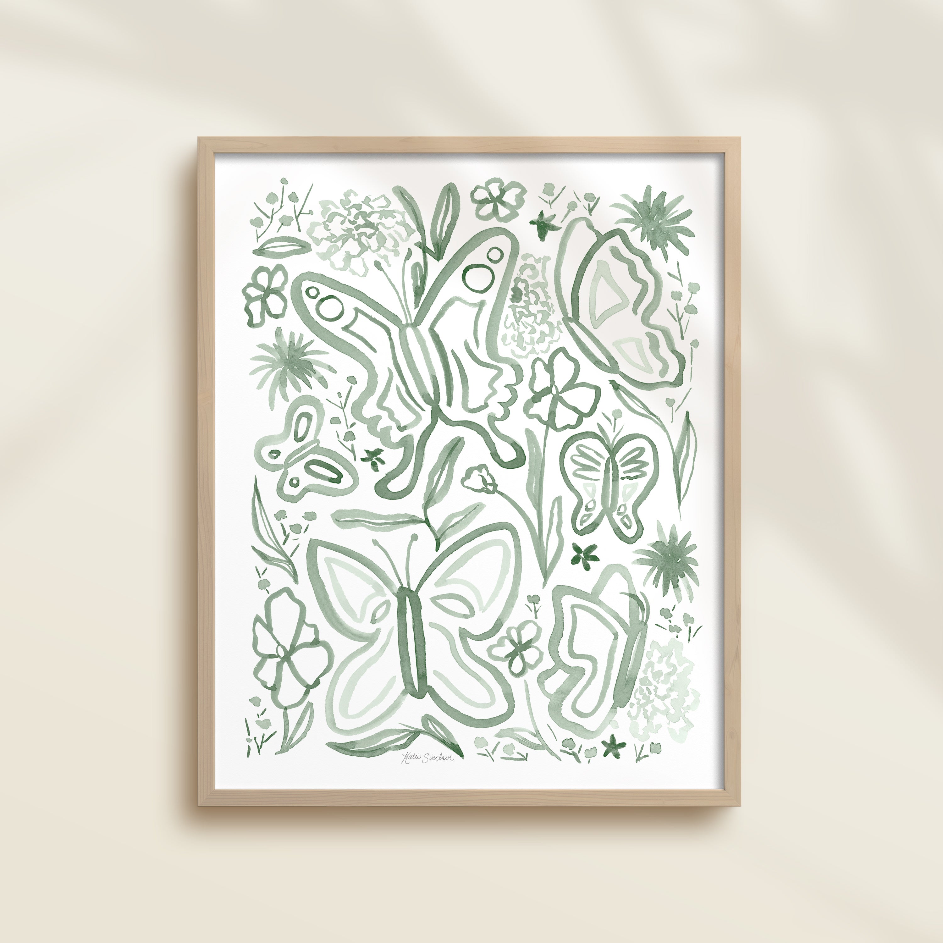Framed hand-painted green watercolor artwork with garden motifs, including butterflies and flowers.