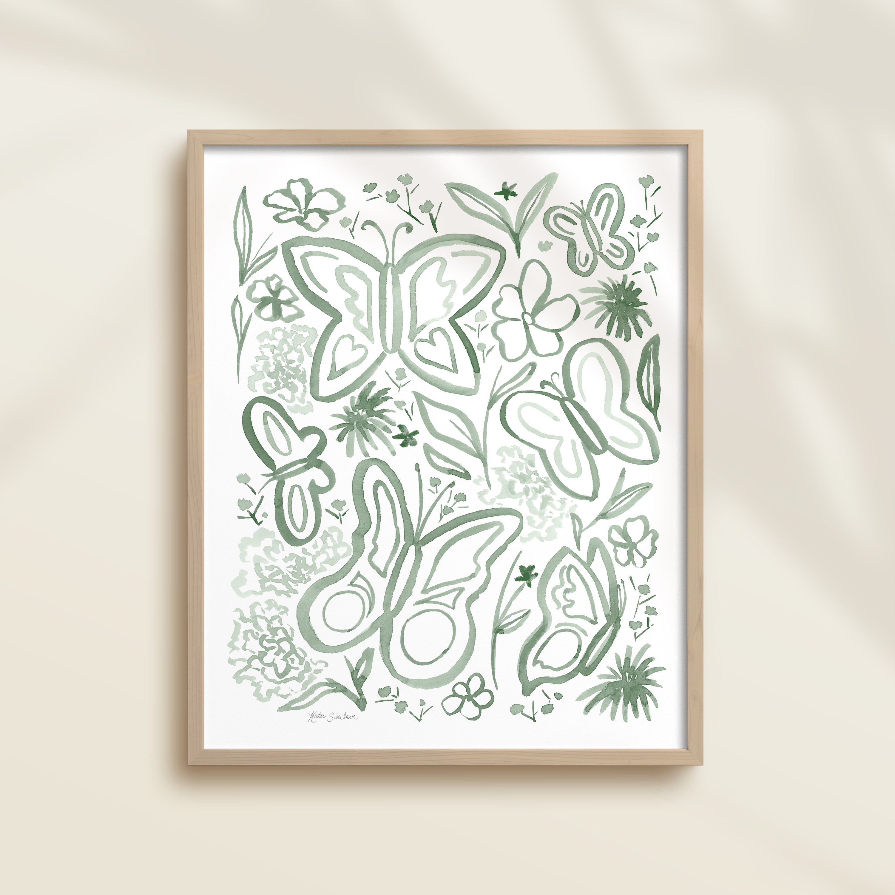 Framed hand-painted green watercolor artwork with garden motifs, including butterflies and flowers.
