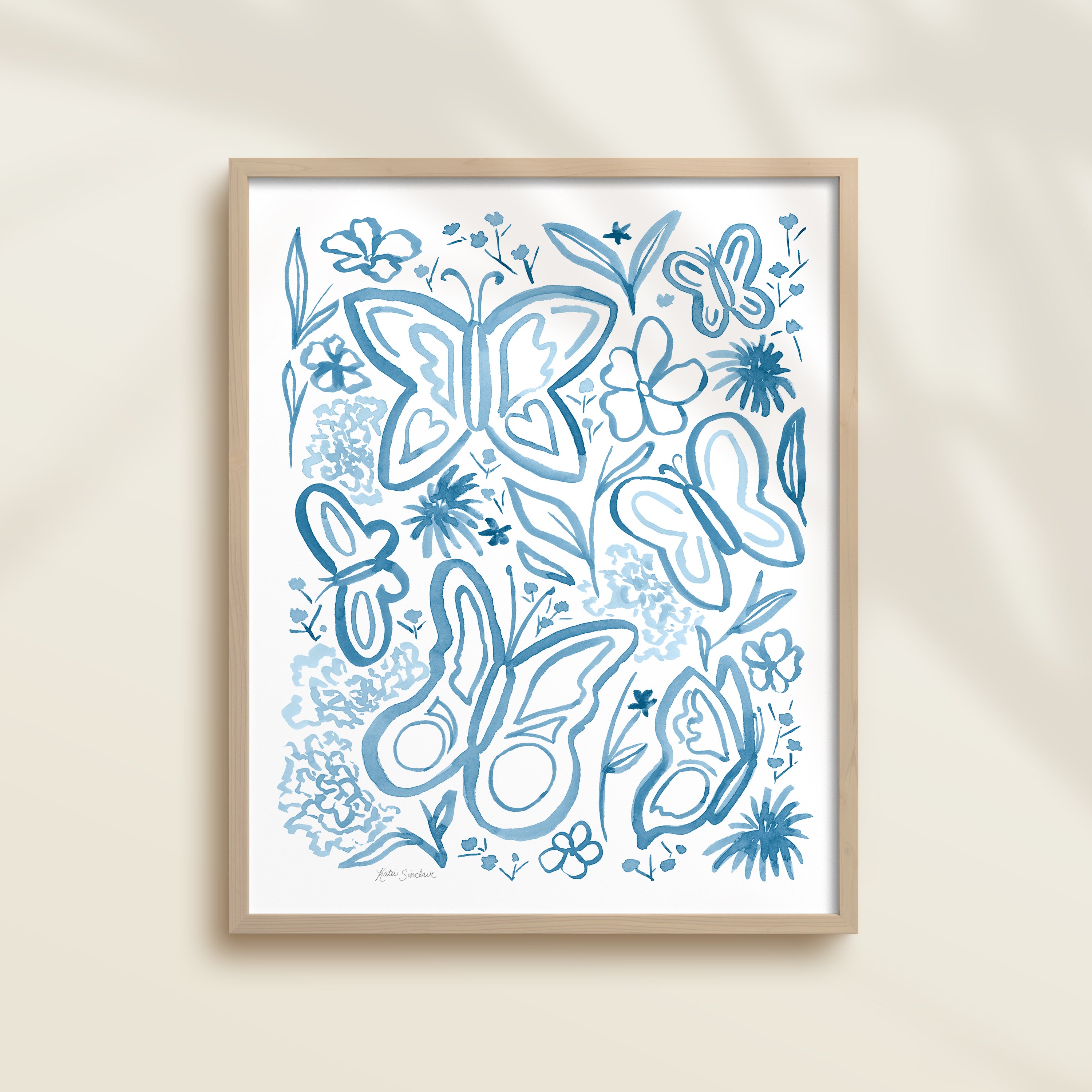 Framed hand-painted blue watercolor artwork with garden motifs, including butterflies and flowers.