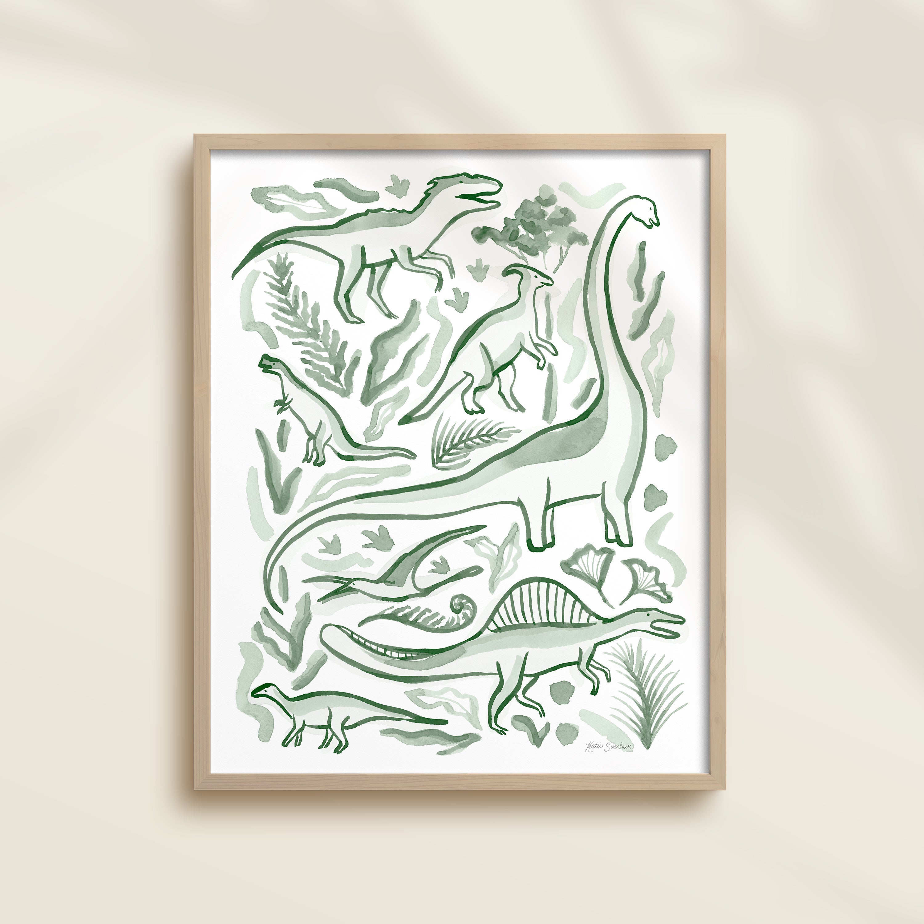 Framed hand-painted watercolor abstract artwork with green dinosaur illustrations on a light background, featuring a brontosaurus, spinosaurus, raptor, and pterodactyl. 
