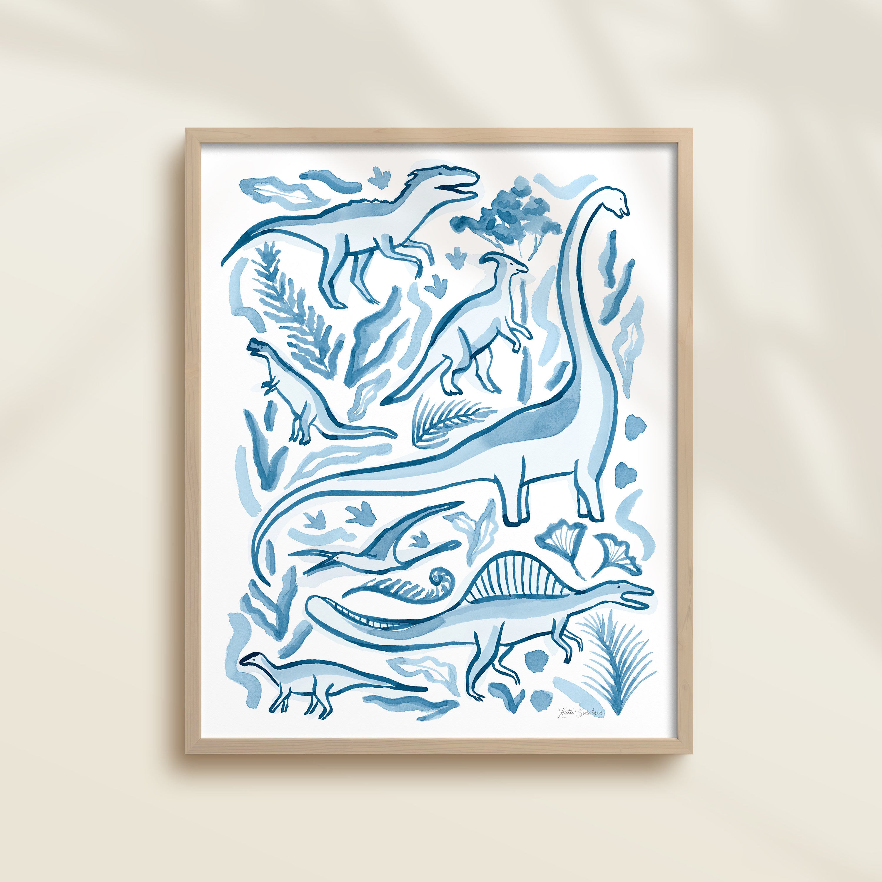 Framed hand-painted watercolor abstract artwork with blue dinosaur illustrations on a light background, featuring a brontosaurus, spinosaurus, raptor, and pterodactyl. 