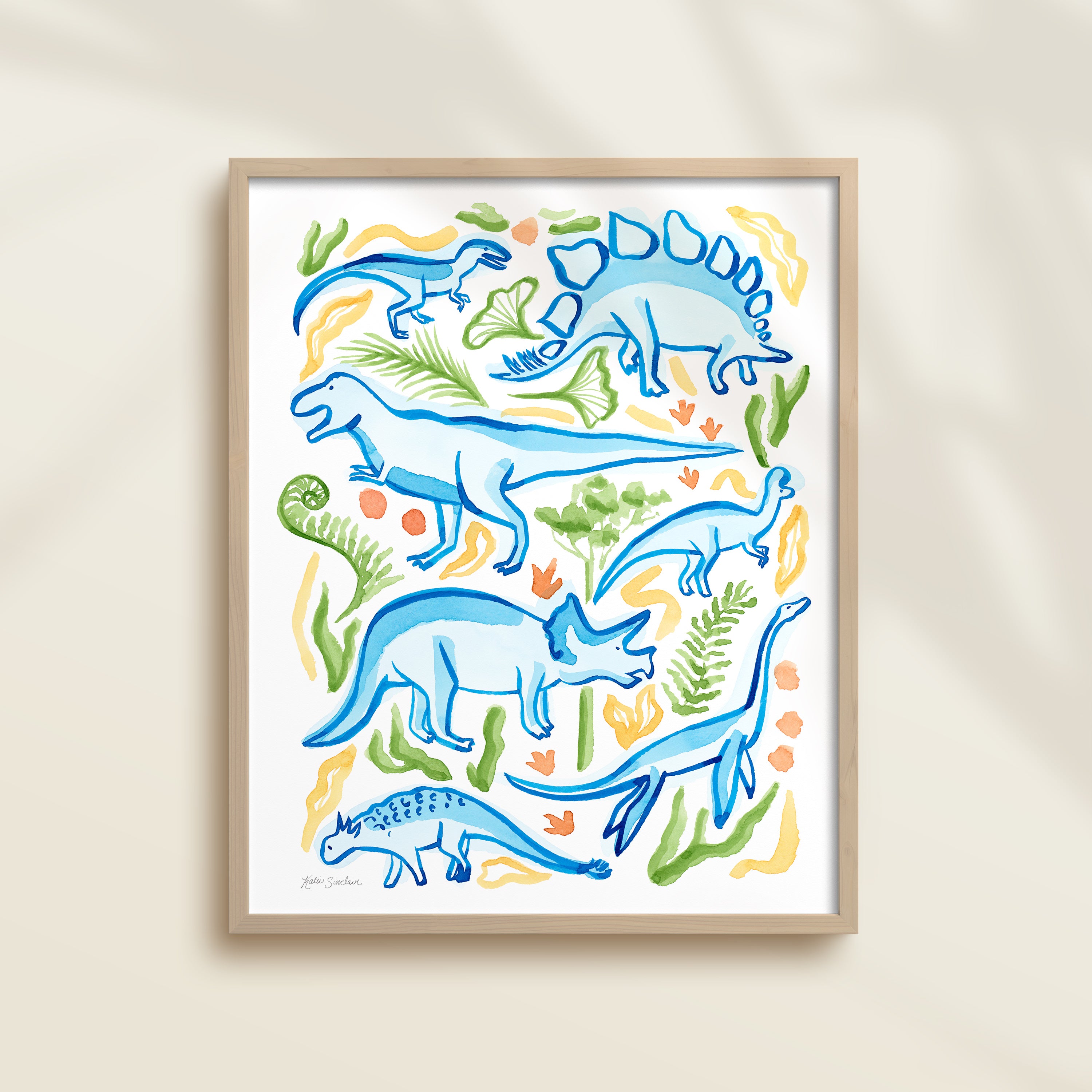 Framed hand-painted watercolor abstract artwork with colorful dinosaur illustrations on a light background, featuring a triceratops, T-Rex, and stegosaurus. 