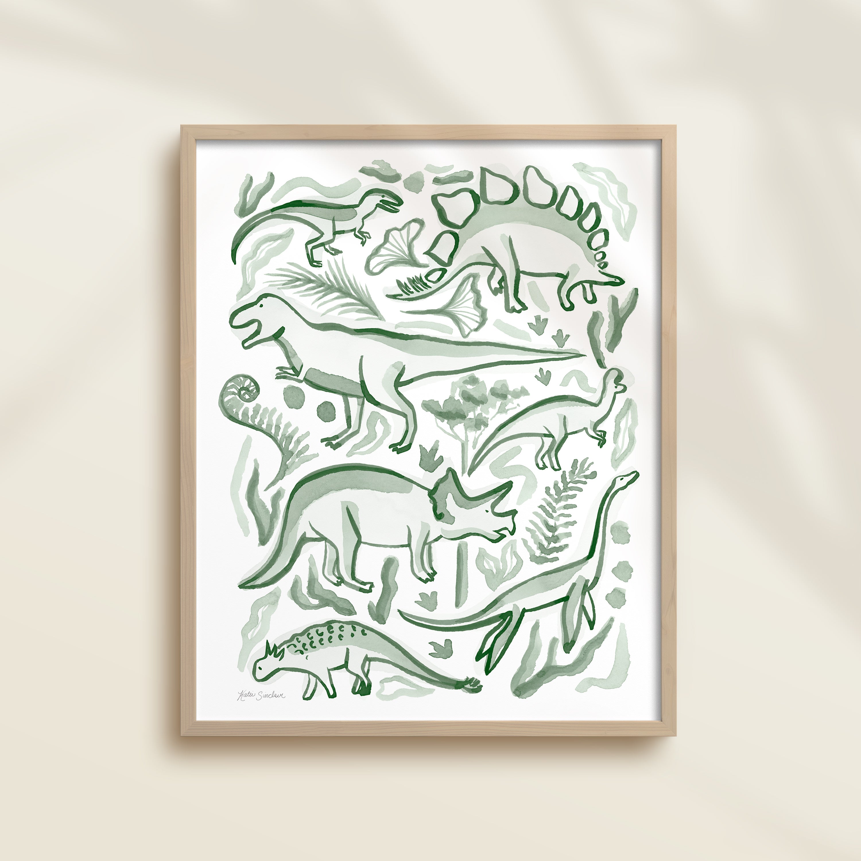 Framed hand-painted watercolor abstract artwork with green dinosaur illustrations on a light background, featuring a triceratops, T-Rex, and stegosaurus. 