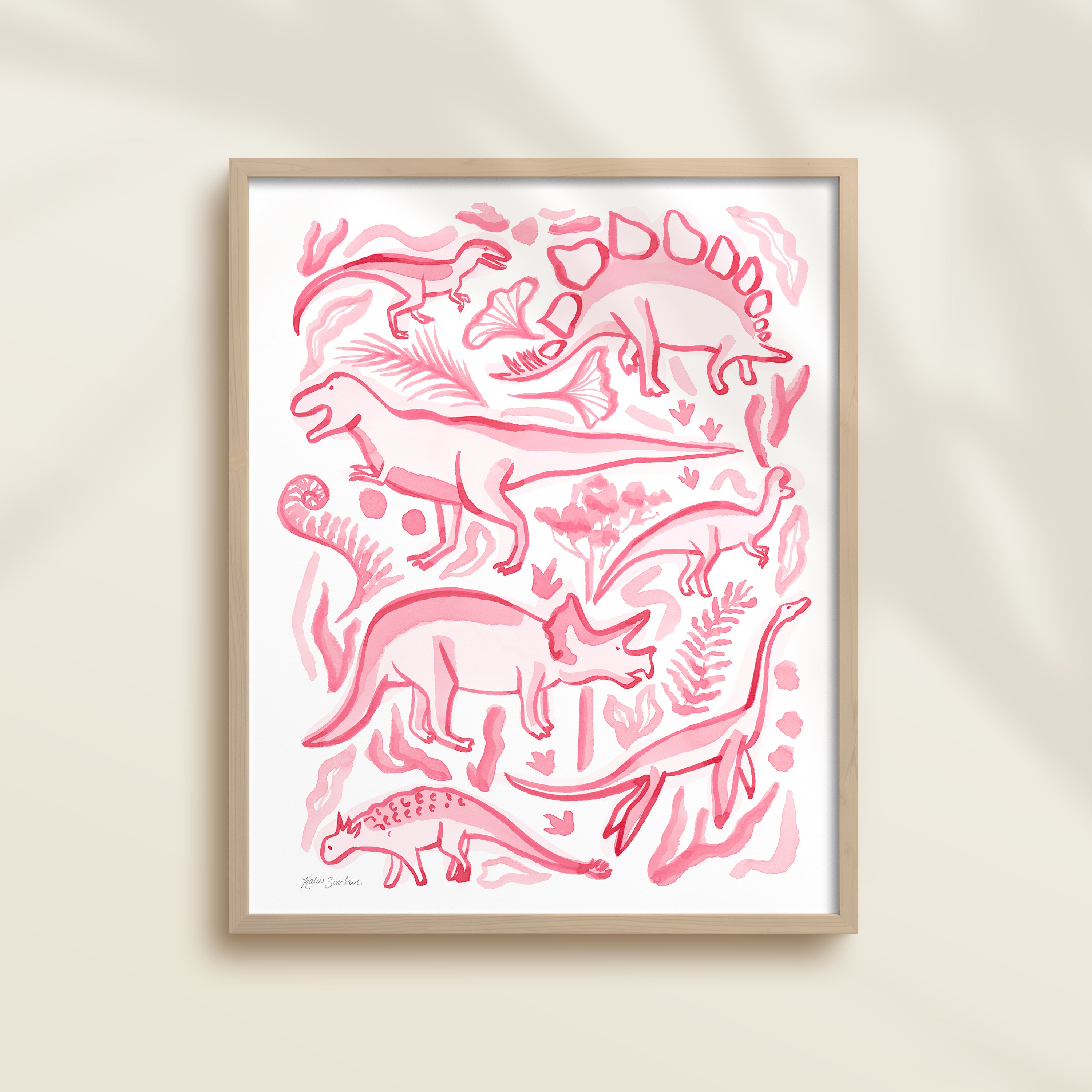 Framed hand-painted watercolor abstract artwork with pink dinosaur illustrations on a light background, featuring a triceratops, T-Rex, and stegosaurus. 