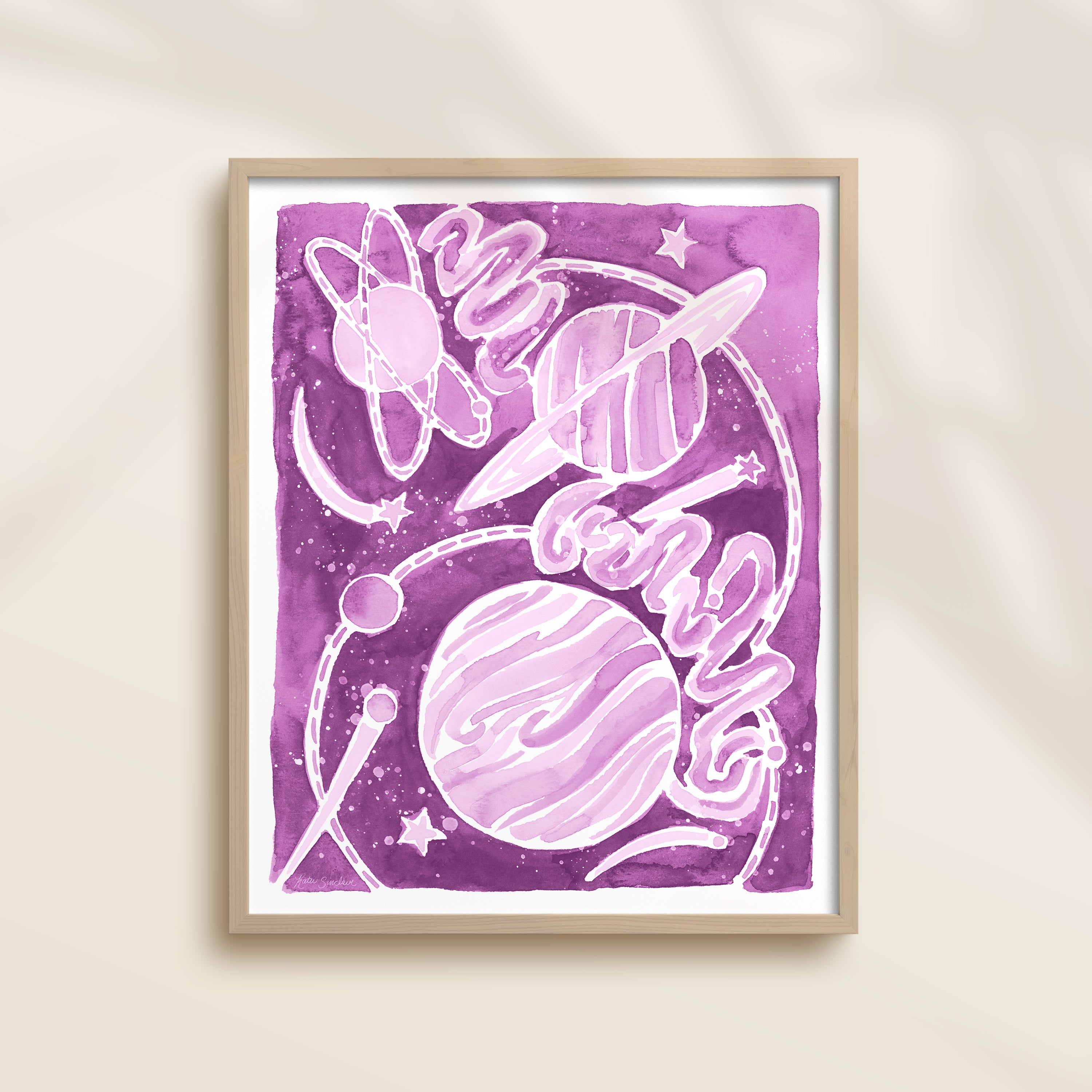 Framed purple watercolor artwork of space-themed design with planets, stars, and a galaxy.