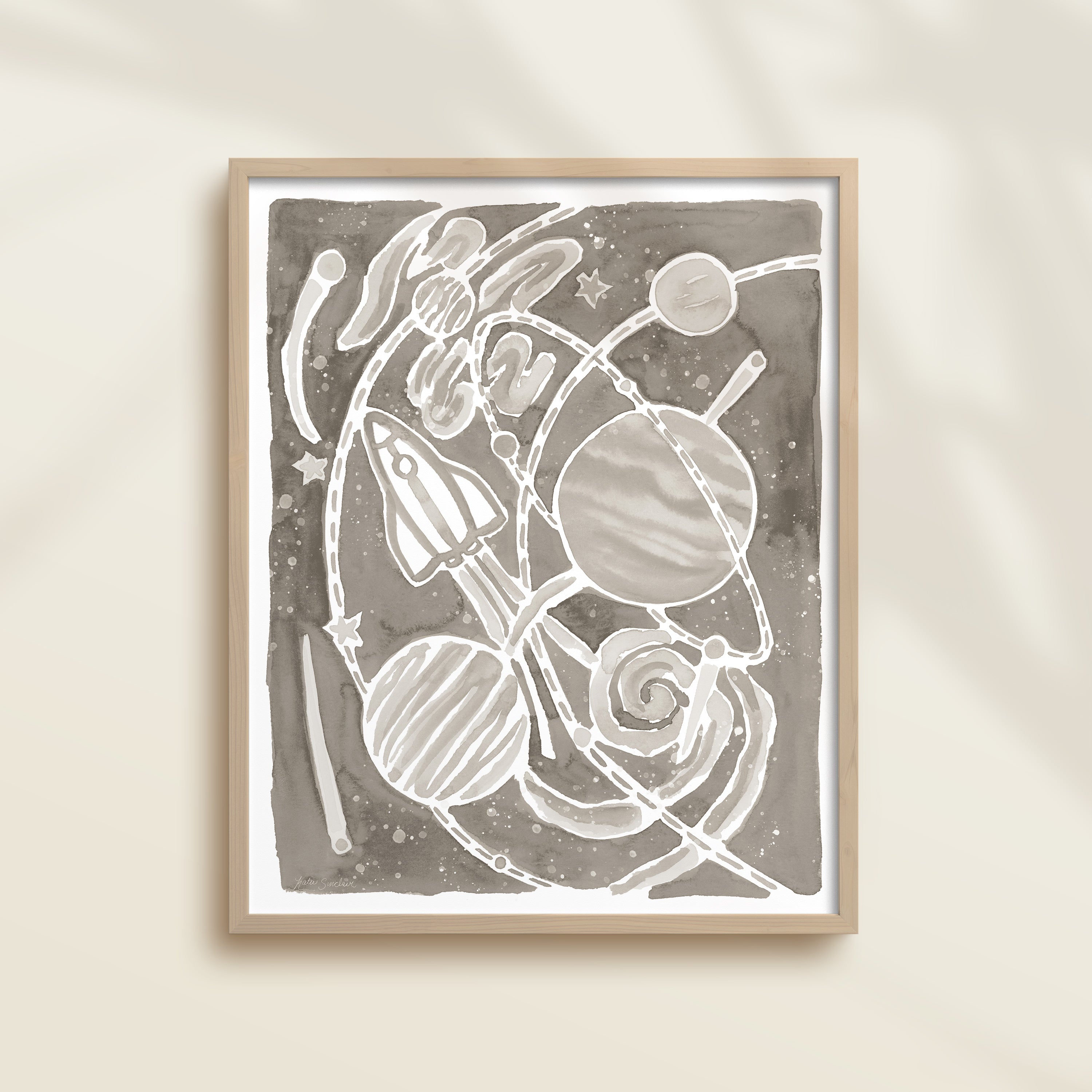 Framed gray watercolor artwork of space-themed design with planets, stars, and a rocket ship.