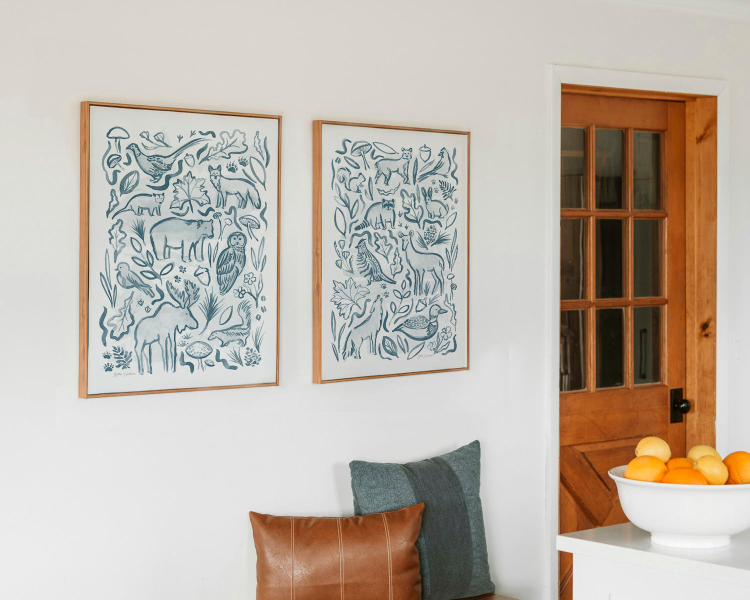 Woodland creatures pair of art prints hanging in a kitchen cabin