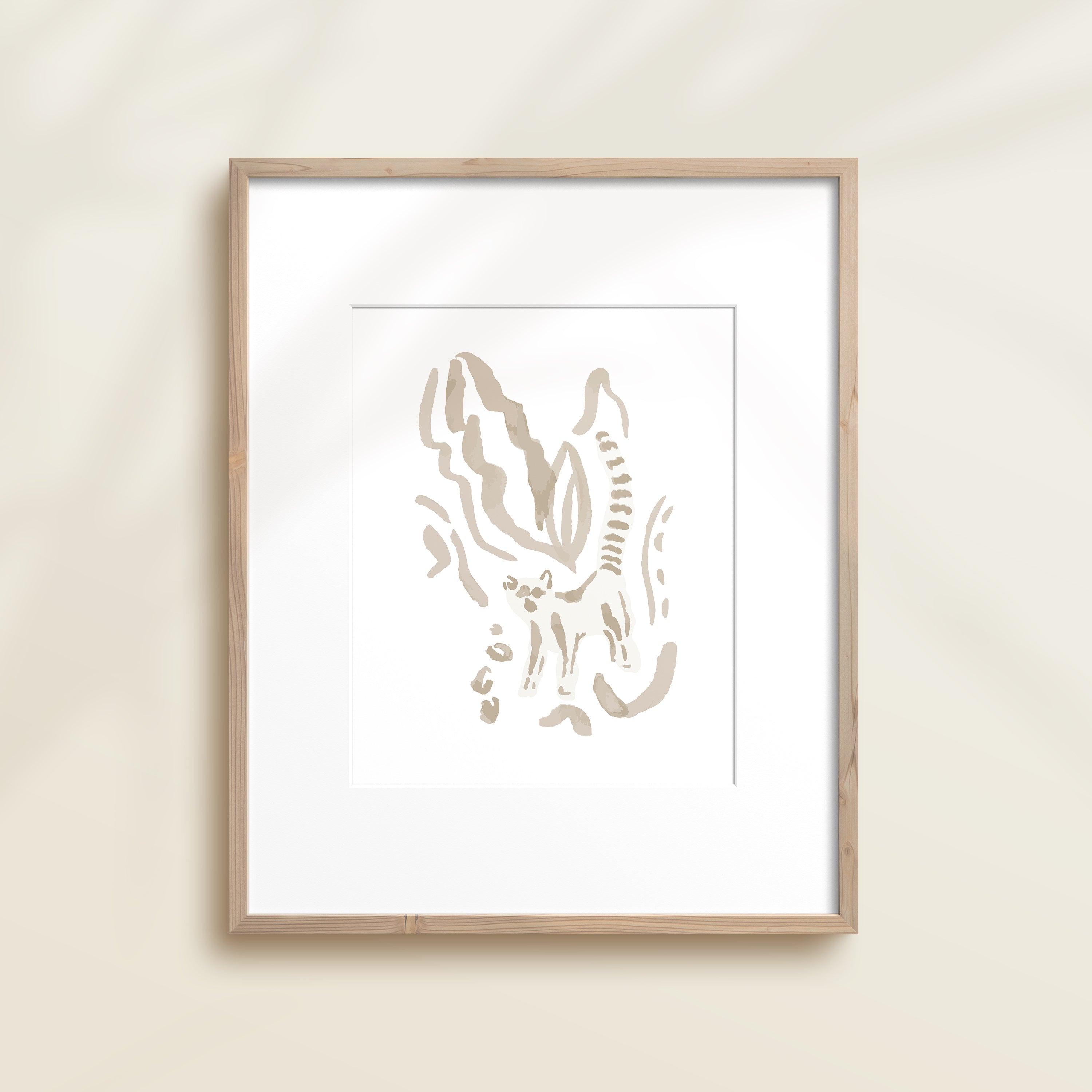 A framed watercolor print by Katie Sinclair of an lemur surrounded by  foliage, displayed on a wall.  This image showcases the gray color version.