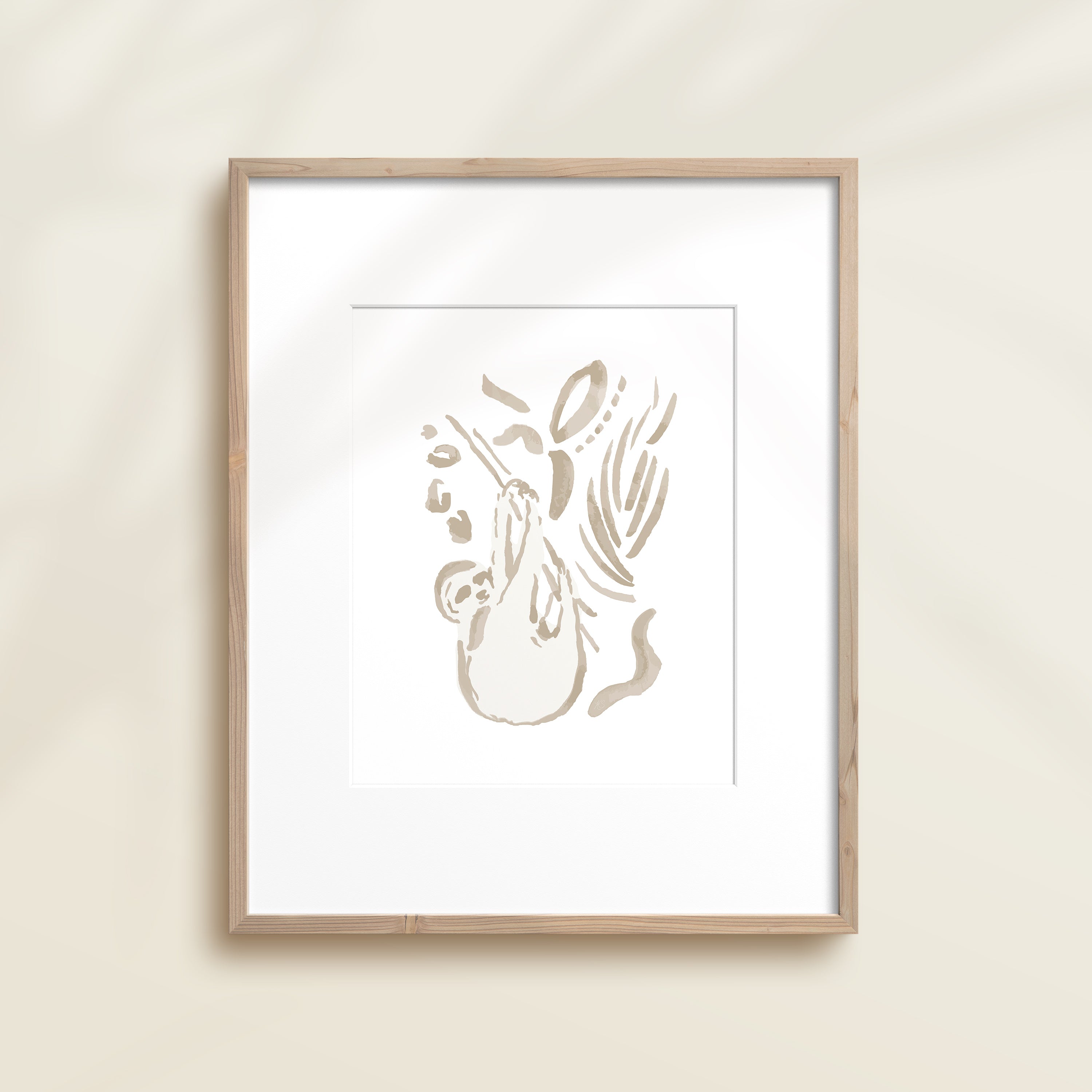 A framed watercolor print by Katie Sinclair of an sloth surrounded by  foliage, displayed on a wall.  This image showcases the gray color version.