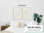 A mockup of the safari jungle watercolor print set by Katie Sinclair in the gray colorway over a queen size bed.