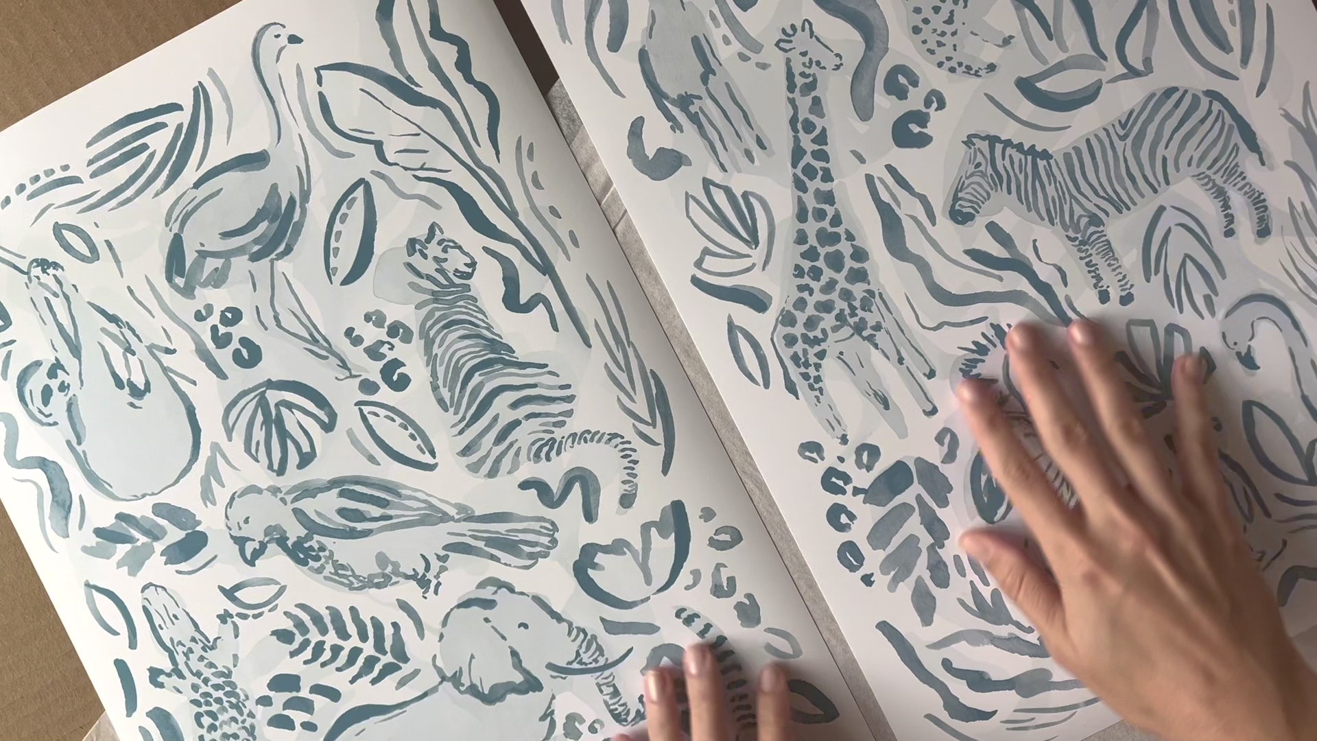 A set of safari jungle watercolor prints by Katie Sinclair Art, video showcasing the colors and texture of the watercolor print and paper.