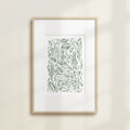 The Safari Jungle Elephant by Katie Sinclair watercolor print in the green colorway, in a wooden frame with a white mat.
