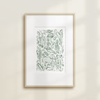 The Safari Jungle Elephant by Katie Sinclair watercolor print in the green colorway, in a wooden frame with a white mat.